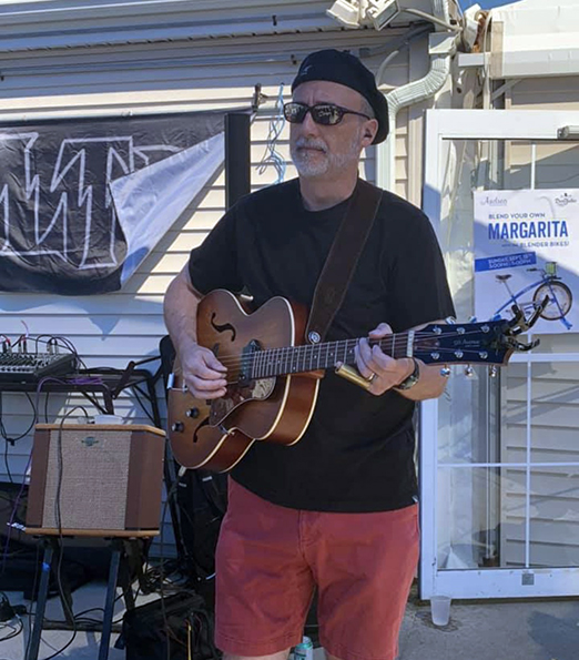 Pete playing slide guitar